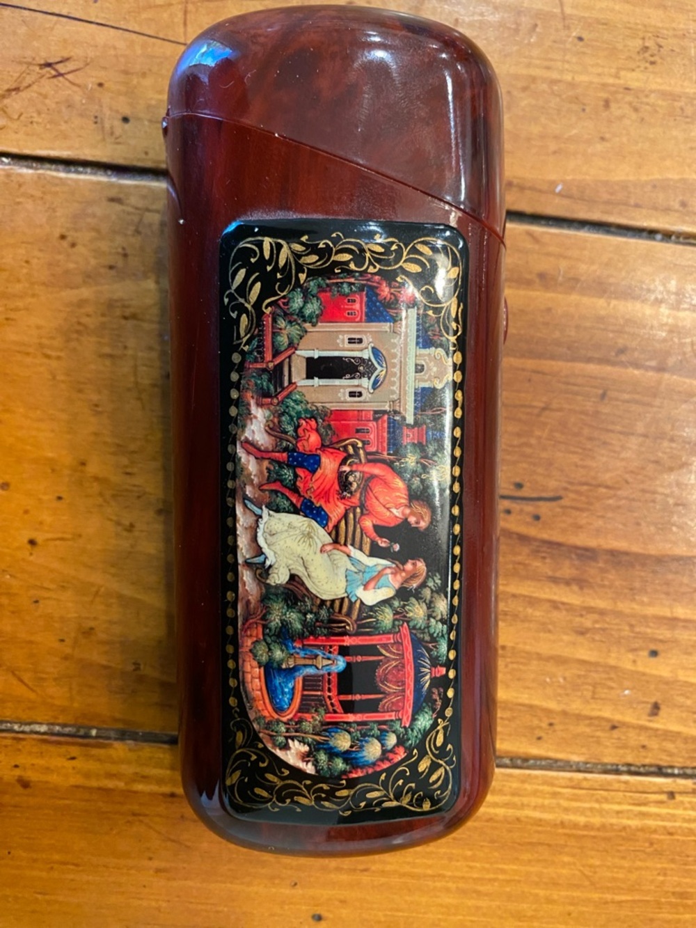 A vintage Russian Palekh-style style lacquer-hinged hand-painted eye glass case